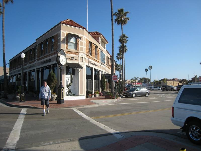 Historic 21 Oceanfront restaurant building with palm trees at Newport Beach