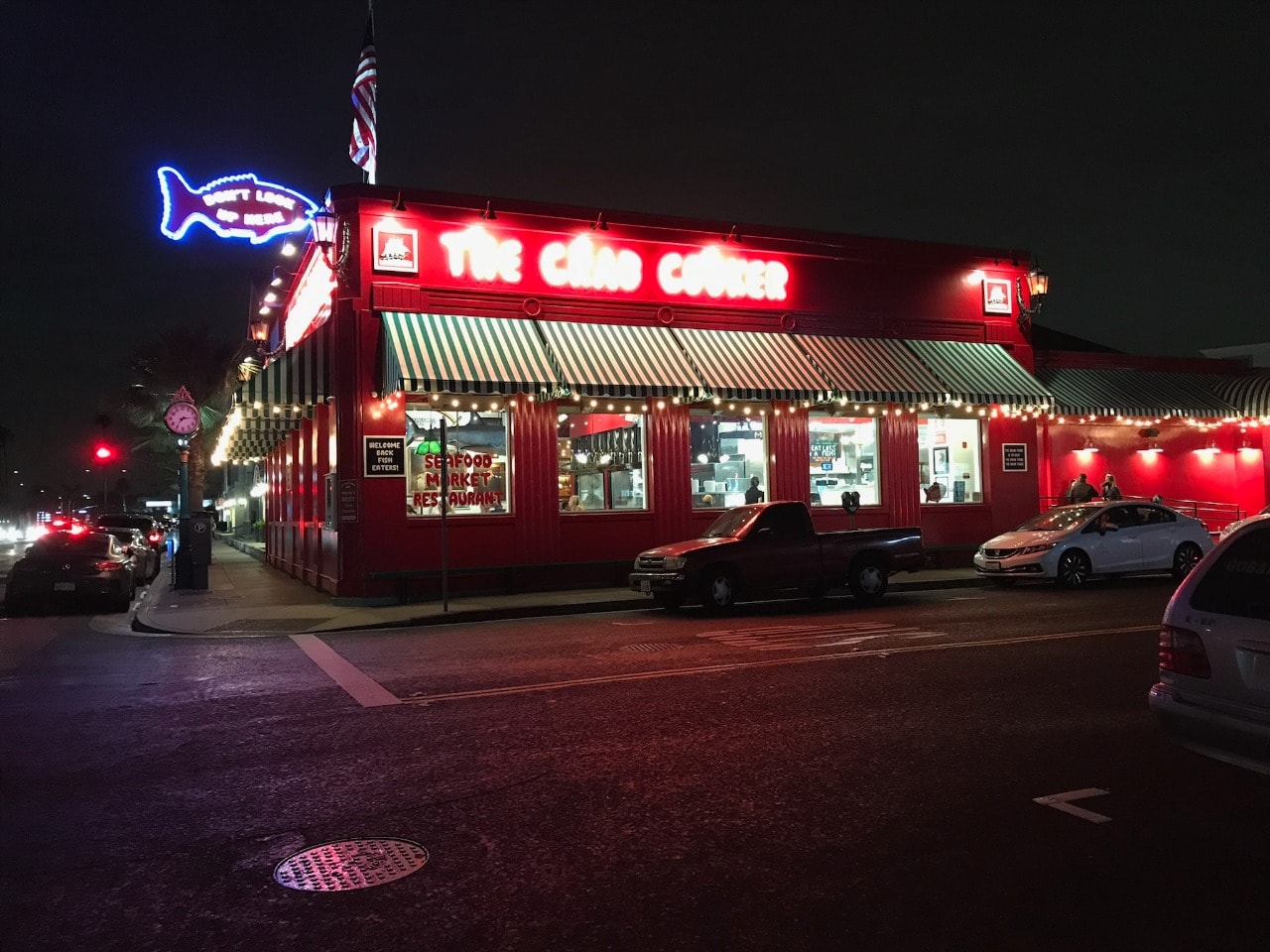 Retro seafood diner neon sign at night near Newport Beach