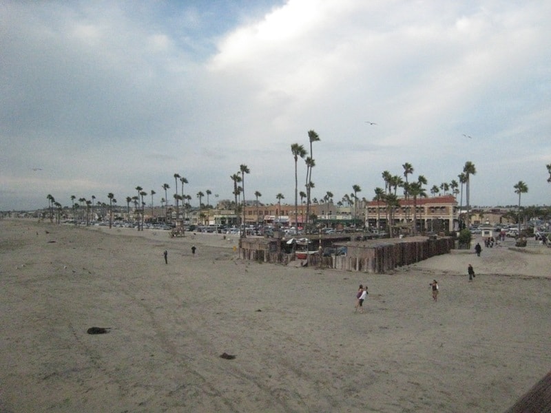 Newport Beach boardwalk with palm trees