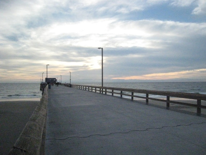 Wooden pier extending into the ocean at Newport Beach
