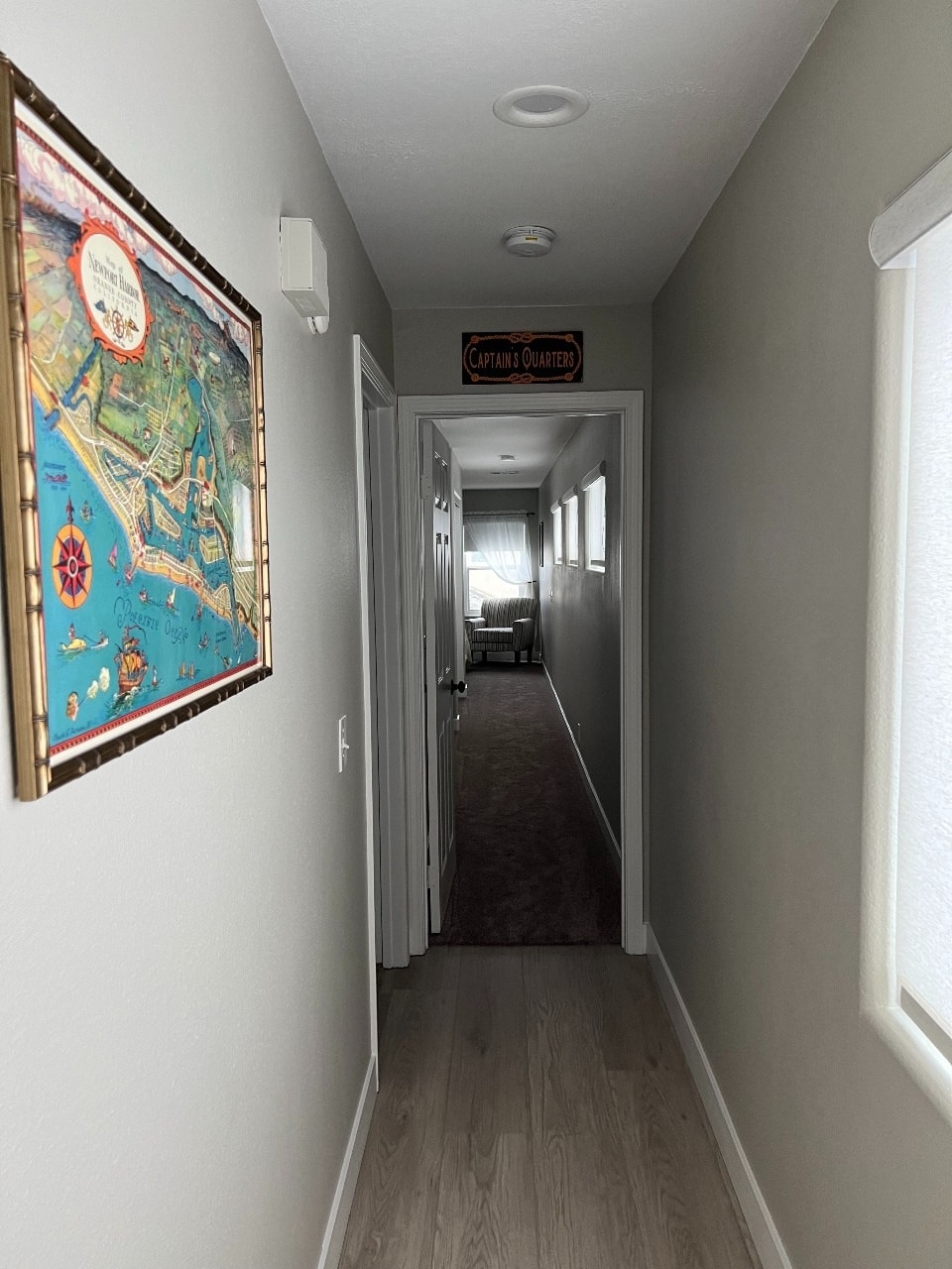 Upper unit hallway with Newport Harbor map art